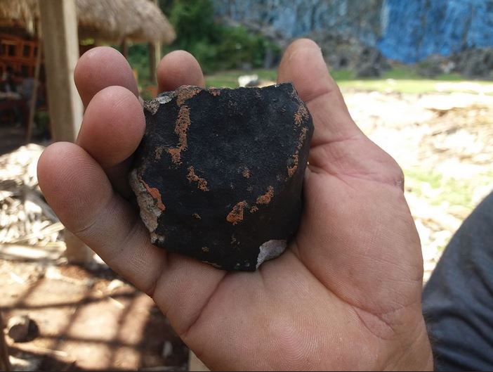 Fragment of meteorite that fell over Western Cuba on February 1st. Credit: Fatima RIVERO/TelePinar/AFP